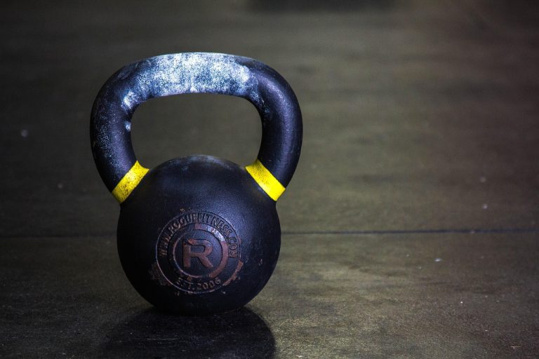 Kettlebell resting on the floor of a training area